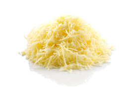 The image displays a heap of freshly grated organic cheese, prepared in the traditional Allgäu dairy manner.