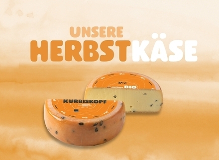 The image presents a selection of our autumnal organic cheeses, including the distinctive Kurbiskopf.
