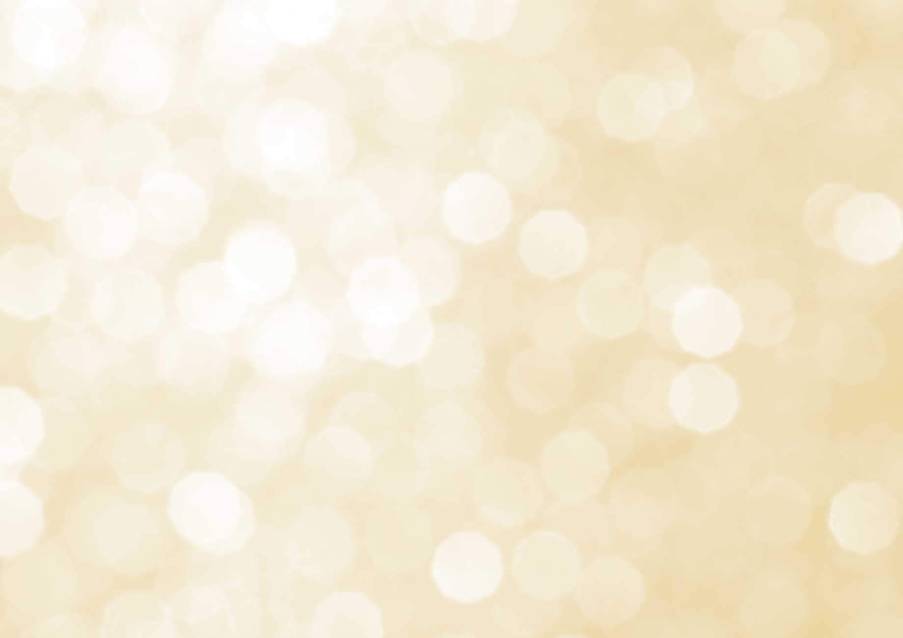 The image shows a blurred, light-coloured background texture with a soft, golden bokeh effect.